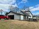 The home features an attached garage at 1902 Mack Rd, Douglasville, GA 30135