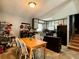 Eat-in kitchen featuring updated cabinets, modern appliances, and an adjacent wooden dining table at 1902 Mack Rd, Douglasville, GA 30135
