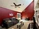 Inviting living room showcasing high ceilings, a ceiling fan, and cozy seating for relaxation and comfort at 1902 Mack Rd, Douglasville, GA 30135