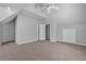 Cozy bedroom features plush carpeting, fan, and ample storage in closet at 4315 Summit Heights Dr, Snellville, GA 30039