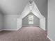 Neutral bedroom featuring carpeted floors and a charming window to brighten the space at 4315 Summit Heights Dr, Snellville, GA 30039