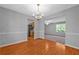 Open dining area with hardwood floors, chandelier, and easy access to the kitchen at 4315 Summit Heights Dr, Snellville, GA 30039