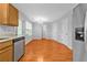 Eat-in kitchen showcasing laminate flooring, modern appliances, and ample cabinet space at 4315 Summit Heights Dr, Snellville, GA 30039