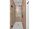 Shower with clear glass door and contemporary tile work at 4315 Summit Heights Dr, Snellville, GA 30039