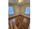 Inviting bedroom with beautiful hardwood flooring and ample sunlight streaming through the windows at 2368 Jernigan Se Pl, Atlanta, GA 30315