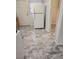 Functional kitchen featuring a white refrigerator, neutral cabinets, and easy-to-clean tile flooring at 2368 Jernigan Se Pl, Atlanta, GA 30315