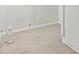 Neutral carpeted basement corner featuring base trim and an electrical outlet, ready for a new owner's personal touch at 2610 Crestdale Se Cir, Atlanta, GA 30316