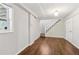 Finished basement with hardwood floors, natural light, and a staircase at 2610 Crestdale Se Cir, Atlanta, GA 30316
