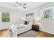 Cozy bedroom with two windows for natural light and modern ceiling fan at 2610 Crestdale Se Cir, Atlanta, GA 30316