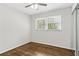 Neutral bedroom with hardwood floors, closet, and window, ready for personalization at 2610 Crestdale Se Cir, Atlanta, GA 30316