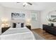 A well-lit bedroom features a queen bed, nightstands, and modern decor at 2610 Crestdale Se Cir, Atlanta, GA 30316