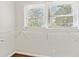 Spacious walk-in closet with two windows, providing ample natural light and storage at 2610 Crestdale Se Cir, Atlanta, GA 30316