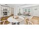 An open concept view of the dining room and living room provides an inviting space to relax and entertain at 2610 Crestdale Se Cir, Atlanta, GA 30316