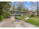 A charming single-Gathering home features a front lawn and a convenient driveway leading to a one-car garage at 2610 Crestdale Se Cir, Atlanta, GA 30316