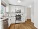 A well-equipped kitchen featuring stainless steel appliances and white cabinets at 2610 Crestdale Se Cir, Atlanta, GA 30316