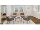 Bright living room with neutral tones, modern furniture, hardwood floors, and natural light from the large windows at 2610 Crestdale Se Cir, Atlanta, GA 30316