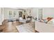 An open-concept living room features a dining area, hardwood floors, and natural light from the backyard doors at 2610 Crestdale Se Cir, Atlanta, GA 30316