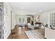 An open-concept living room features a dining area, hardwood floors, and natural light from the backyard doors at 2610 Crestdale Se Cir, Atlanta, GA 30316