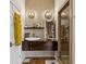 Modern bathroom boasts stylish vanity, mirror, lighting and walk-in shower at 307 Cherokee Se Ave # 3, Atlanta, GA 30312