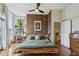 Well decorated bedroom with a textured accent wall and a fan on the ceiling at 307 Cherokee Se Ave # 3, Atlanta, GA 30312