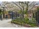 Exterior of the property with gated entry and lush landscaping at 307 Cherokee Se Ave # 3, Atlanta, GA 30312