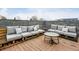 Inviting rooftop deck with comfortable gray cushioned seating and a small table for outdoor entertaining at 307 Cherokee Se Ave # 3, Atlanta, GA 30312