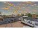 Rooftop deck featuring lounge seating with a view of the city skyline at sunset at 307 Cherokee Se Ave # 3, Atlanta, GA 30312
