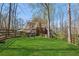 Beautiful backyard featuring lush green lawn and mature trees at 5388 Frazer Rd, Buford, GA 30518