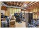 Unfinished basement features exposed beams and insulation, offering customization potential at 5388 Frazer Rd, Buford, GA 30518