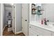 Stylish bathroom with white vanity, chrome fixtures, and decorative storage baskets at 5388 Frazer Rd, Buford, GA 30518