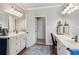 This bathroom features double sinks with plentiful countertop space at 5388 Frazer Rd, Buford, GA 30518
