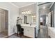 This bathroom features double vanities and abundant natural light at 5388 Frazer Rd, Buford, GA 30518