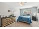 Bedroom with patterned wallpaper, dresser and great natural light at 5388 Frazer Rd, Buford, GA 30518