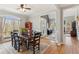 Elegant dining room with hardwood floors, ample natural light, and open access to the foyer at 5388 Frazer Rd, Buford, GA 30518