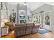 Cozy living room featuring a fireplace, vaulted ceilings, and ample natural light at 5388 Frazer Rd, Buford, GA 30518