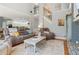Comfortable living room with a fireplace, neutral tones and access to an upper level at 5388 Frazer Rd, Buford, GA 30518