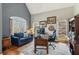 Cozy office space with ample natural light, comfortable seating, and wood accents at 5388 Frazer Rd, Buford, GA 30518