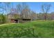Green pasture featuring outbuilding with horse fencing at 5388 Frazer Rd, Buford, GA 30518
