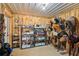 Tack room featuring saddle racks, shelving, and riding equipment at 5388 Frazer Rd, Buford, GA 30518