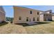 Exterior view of a two story home in a backyard featuring a patio, and green grass lawn at 624 Leafy Branch Way, Mcdonough, GA 30253