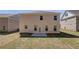 Exterior view of a two story home in a backyard featuring a patio, and green grass lawn at 624 Leafy Branch Way, Mcdonough, GA 30253