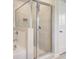 Bathroom featuring tiled glass door shower, soaking tub and tile floors at 624 Leafy Branch Way, Mcdonough, GA 30253