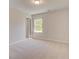 Neutral bedroom with plush carpeting, one window, and a ceiling light at 624 Leafy Branch Way, Mcdonough, GA 30253