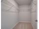 Walk-in closet space with wire shelving and plush carpet at 624 Leafy Branch Way, Mcdonough, GA 30253