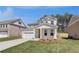 Attractive home with a two-car garage, front lawn, and well-kept landscaping at 624 Leafy Branch Way, Mcdonough, GA 30253
