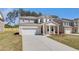 Lovely two-story house showcasing a spacious driveway and manicured front yard at 624 Leafy Branch Way, Mcdonough, GA 30253