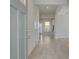 Bright foyer with light wood floors, neutral walls, and a glimpse of the open floor plan at 624 Leafy Branch Way, Mcdonough, GA 30253