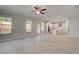 Open concept living and kitchen area with modern appliances, island and light wood-look flooring at 624 Leafy Branch Way, Mcdonough, GA 30253
