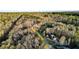 An aerial view of a private residence nestled among trees at 114 Hardwood Ln, Canton, GA 30115