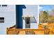 Back entrance featuring a covered porch and wooden deck at 114 Hardwood Ln, Canton, GA 30115